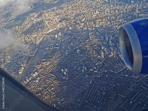 central london ariel view from airliner window showing engine and river thames photo