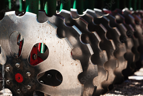 Fotografi Close up of tractor disc harrows, agricultural machinery equipment