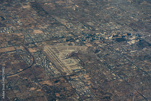 Las Vegas and Paradise in Nevada, with Las Vegas strip skyline and Harry Reid International Airport  - panoramic aerial view  