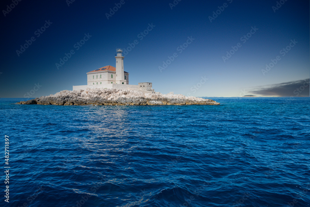 Croatia. Mulo lighthouse, also called Franz Joseph lighthouse on a small rocky island. Close to the town of Rogoznica. Adriatic Sea.