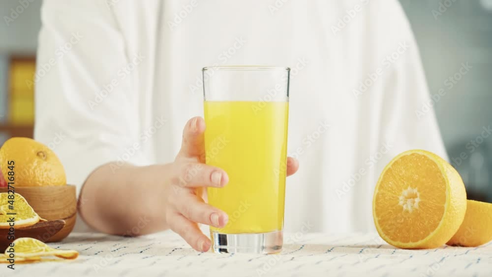 Drinking juice. Effervescent tablet vitamin C nutritional supplements in glass with yellow carbonated water, sport medication, healthy morning. Aspirin antipyretic drugs Drinking juice. Effervescent tablet vitamin C nutritional supplements in glass with yellow carbonated water, sport medication, healthy morning. Aspirin antipyretic drugs