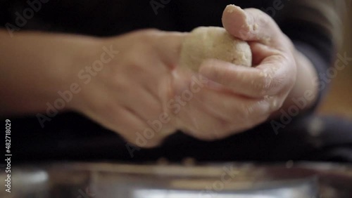 close up of hands preparing a traditional arabic food