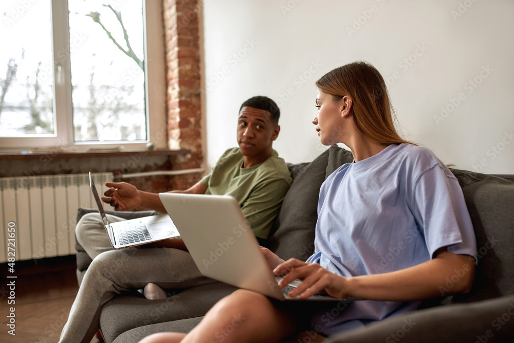 Man showing on his laptop for caucasian girlfriend Man showing on his laptop for caucasian girlfriend