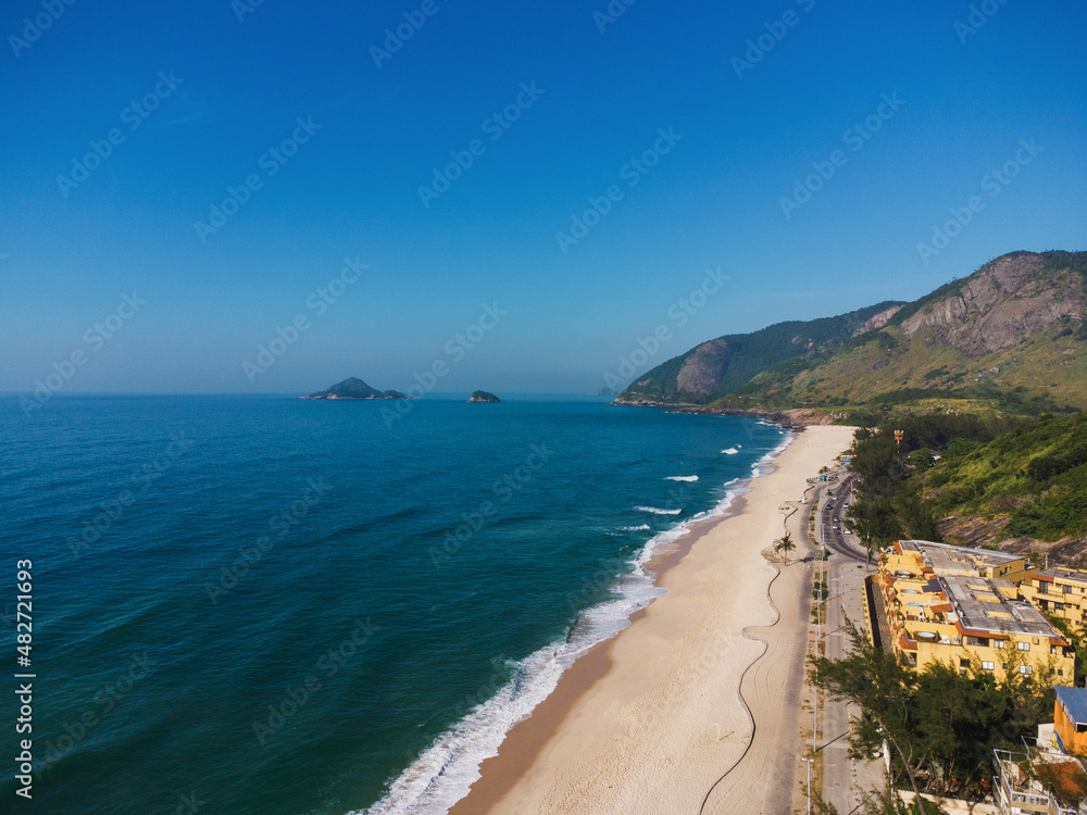Aerial view of Praia da Macumba, in Rio de Janeiro, Brazil. Beach on the west side of the city. Sunny day at morning. Drone Photo