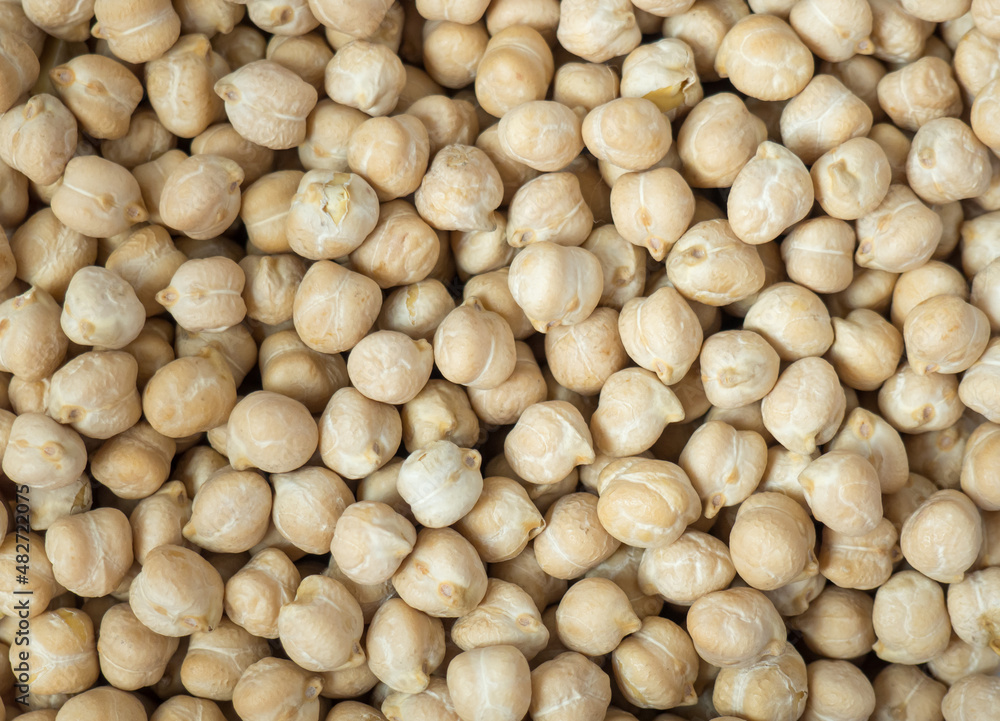 Dry chickpea background, top view. Background of chickpea seeds, close-up. Dry chickpea background, top view. Background of chickpea seeds, close-up.