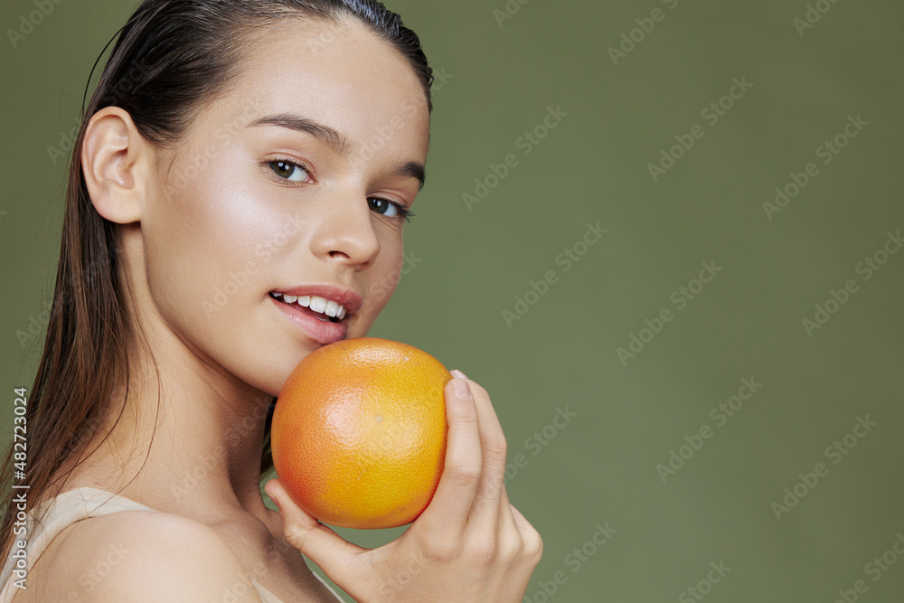 portrait woman with grapefruit near face clean skin care health isolated background portrait woman with grapefruit near face clean skin care health isolated background