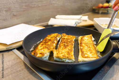 lavash appetizer fried in a pan. Snack for party with friends. close up