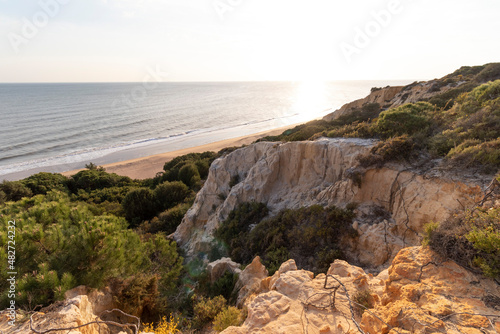 Spain s longest coastline is the coast of Huelva. From  Matalascanas  to  Ayamonte . Coast with cliffs  dunes  pine trees  green vegetation. It is considered one of the most beautiful beaches in Spain