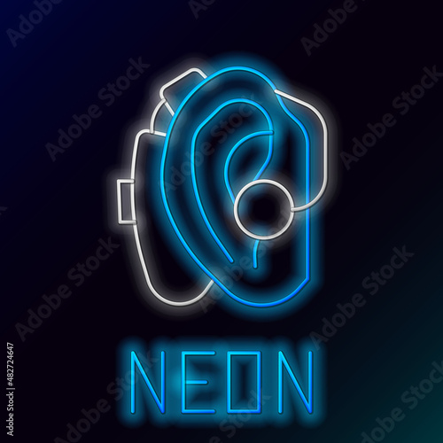 Glowing neon line Hearing aid icon isolated on black background. Hearing and ear. Colorful outline concept. Vector