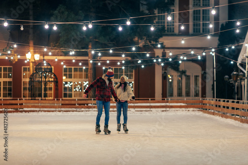 Biracial couple on an ice skating date