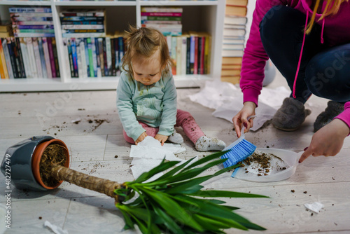 Photography one caucasian baby girl making mess playing and mischief with bad behavior rippi