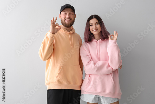 Cool young couple in hoodie...