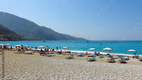 Fethiye Oludeniz beach people swim and relax on the sea. Fethiye Turkey August 2021        