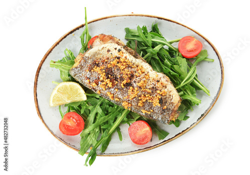 Plate of tasty sea bass fish and vegetables on white background