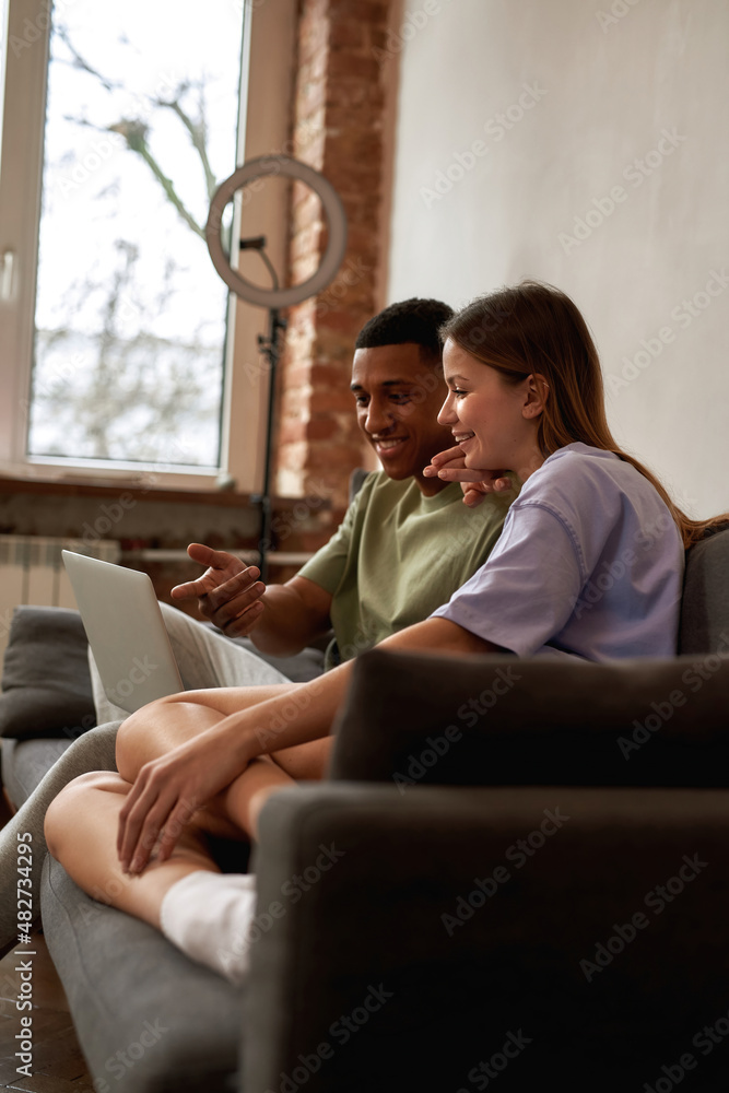 Man show on laptop for girl during edit content