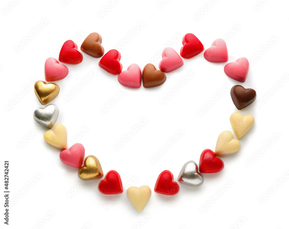 Heart made of chocolate candies on white background Heart made of chocolate candies on white background