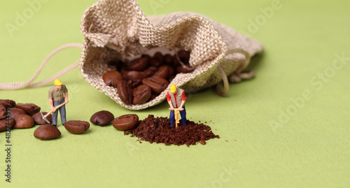 Coffee beans and two miniature workers. Miniature people with business concept.  © Hyejin Kang