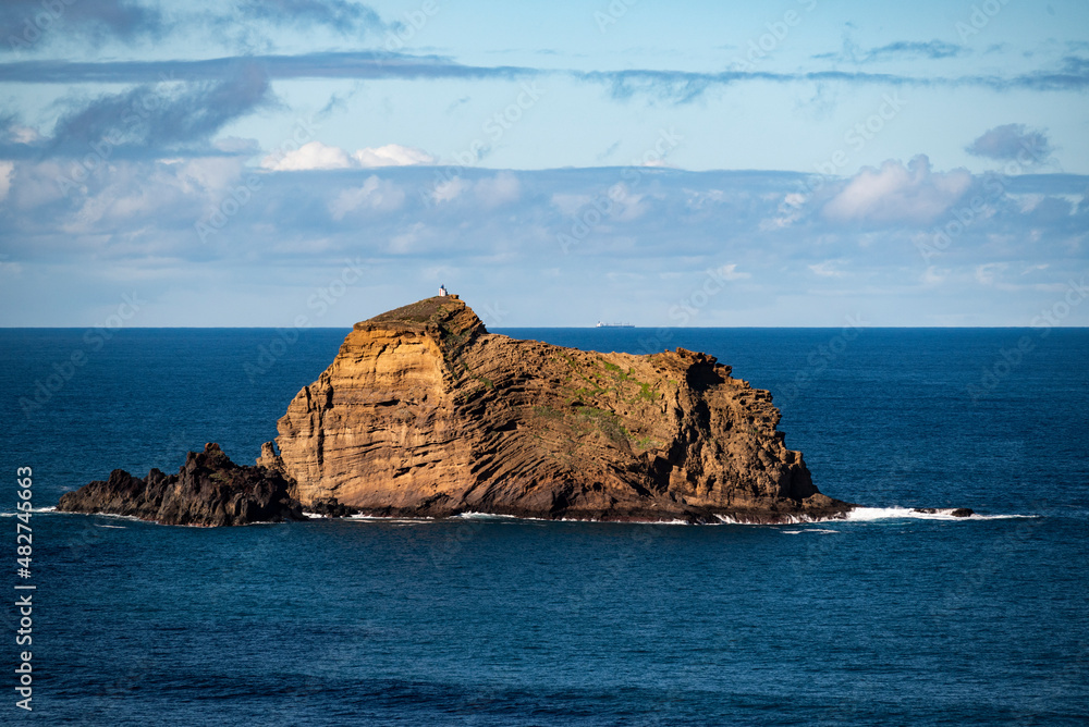 Scenic view of the “Ilheu Mole”, the lighthouse island on the coast of Porto Moniz, Madeira, Portugal