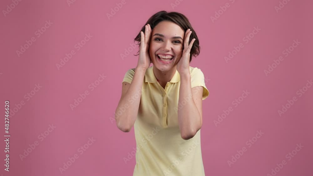 Funky lady fooling cover palm face play game isolated pastel color background Funky lady fooling cover palm face play game isolated pastel color background