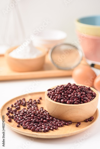 Azuki bean and wheat flour on white background. Natural organic products, healthy baking ingredients