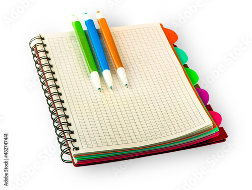 red Diary notebook and colored pens isolated on white background. photo