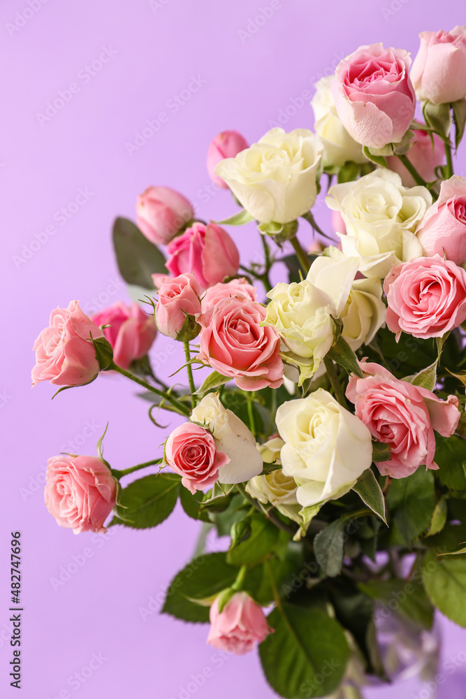Bouquet of beautiful roses on purple background Bouquet of beautiful roses on purple background