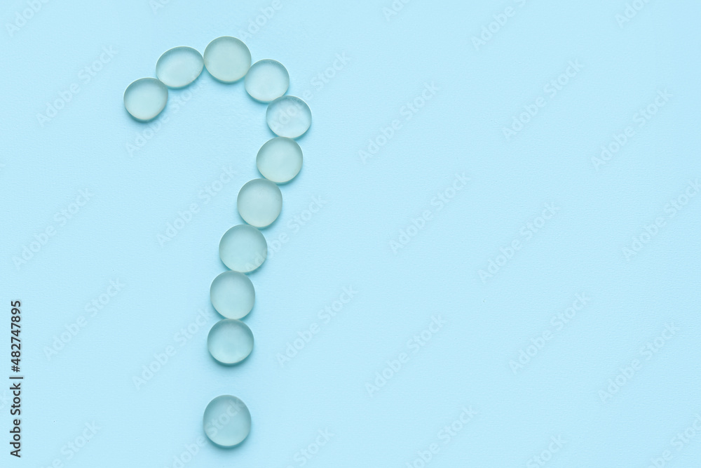 Question mark made of glass stones on color background Question mark made of glass stones on color background