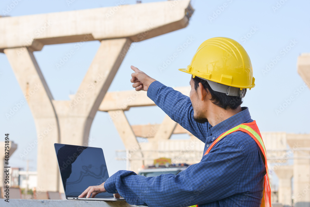 Asian Engineer Standing outdoor on a Construcion Asian Engineer Standing outdoor on a Construcion