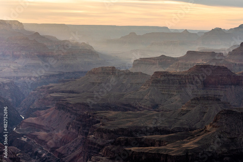 Afternoon Light Mixes with Clouds Over Layers of the Grand Canyon