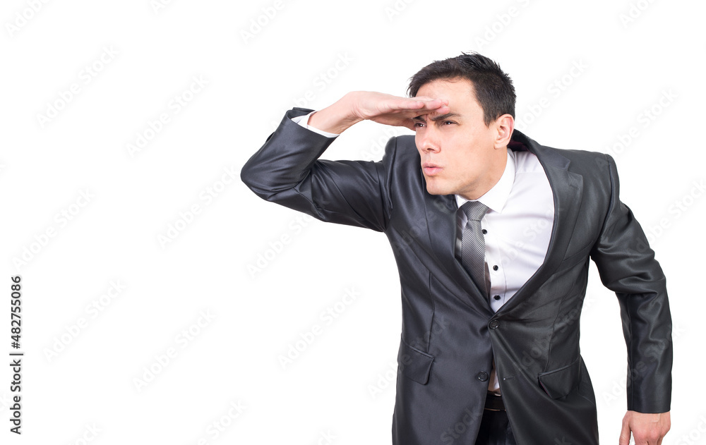 Attentive man keeping hand on forehead and looking at distance Attentive man keeping hand on forehead and looking at distance
