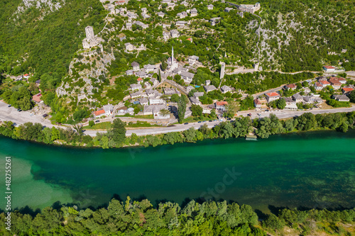 Aerial view of old medieval castle and emerald water of Neretva river in Pocitelj town in Bosina and Herzegovina photo