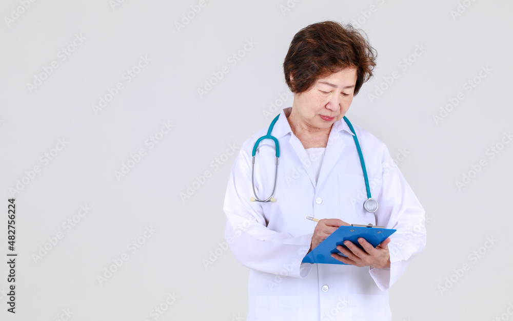 Elegant senior female doctor on physician gown confidently standing as hospitally health expert for disease treatment at clinic.