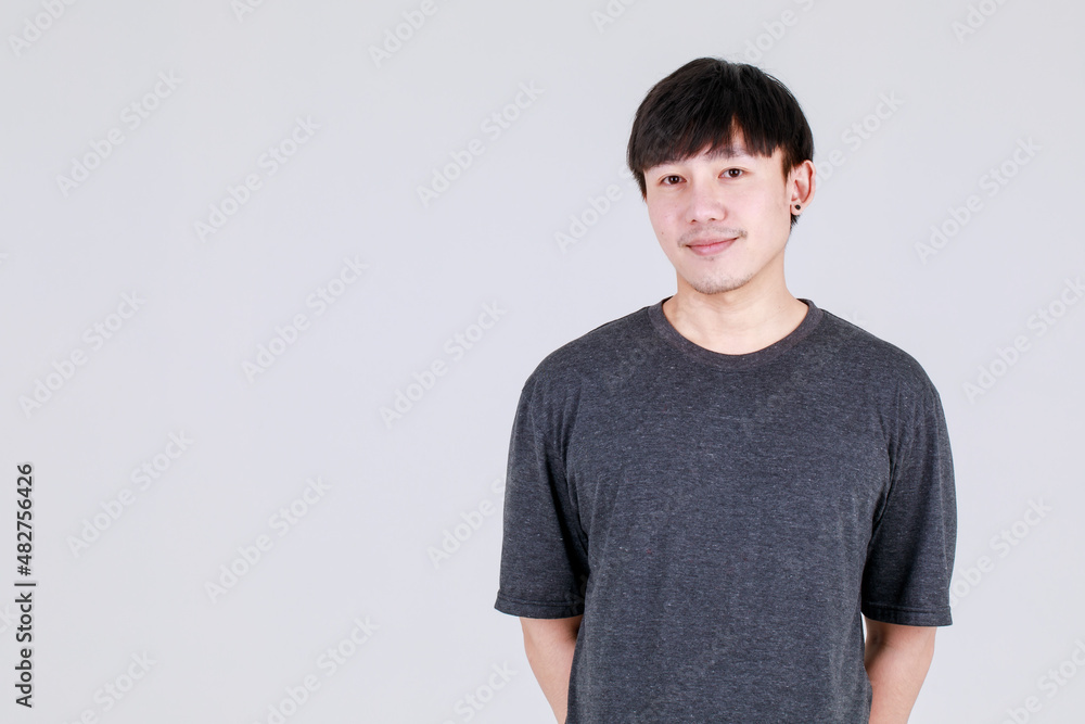 Smile and happy face of Asian man on casual wear to present copy space of content, on white background concept Smile and happy face of Asian man on casual wear to present copy space of content, on white background concept