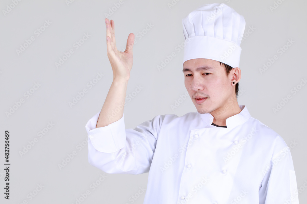 Experienced and smart chinese chef on elegant cooking uniform smile and standing confidently at kitchen with arm crossed as qualified expert of cuisine for luxurious dining Experienced and smart chinese chef on elegant cooking uniform smile and standing confidently at kitchen with arm crossed as qualified expert of cuisine for luxurious dining
