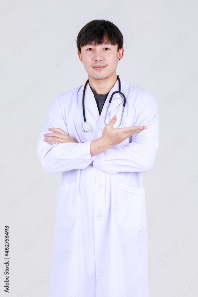 Smart young chinese physician on medical professional gown with stethoscope smile with confident and happy to success disease treatment with safe. Doctor pleased and ensure health care. Smart young chinese physician on medical professional gown with stethoscope smile with confident and happy to success disease treatment with safe. Doctor pleased and ensure health care.