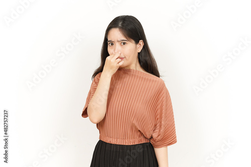 Smelling something stinky and disgusting Of Beautiful Asian Woman Isolated On White Background © Sino Images Studio