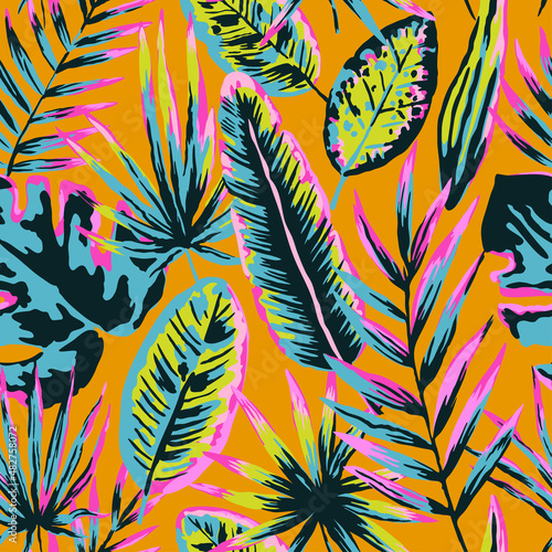 Seamless pattern with modern neon tropical leaves and plants for design and textile.