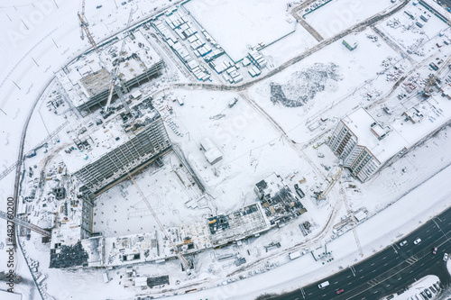 winter aerial view of construction site at residential area. new apartment buildings under construction. © Mr Twister