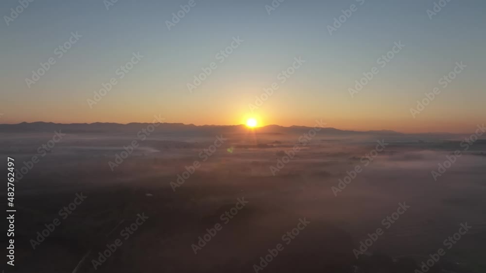 Beautiful of blue sky and sunrise at morning with clouds of fog on ground. aerial view. Beautiful of blue sky and sunrise at morning with clouds of fog on ground. aerial view.
