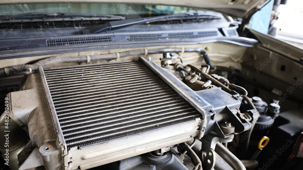 Dirty intercooler. Aluminum fins of a car intercooler clogged with