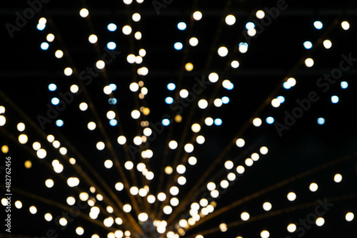 soft focus and blurred of row of lighting bokeh and blurred background on party dark night.