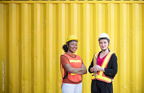 A portrait of female workers at cargo distribution warehouse. 