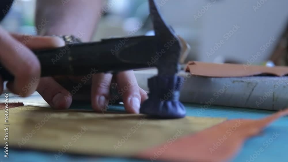 Hammer on two pieces of leather. For more strength, the leather parts should be hammered with a plastic hammer Hammer on two pieces of leather. For more strength, the leather parts should be hammered with a plastic hammer