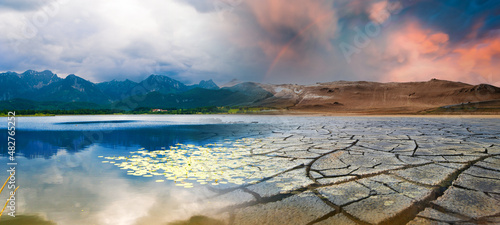 Landscape with mountains and a lake and a dried desert. Global climate change concept photo