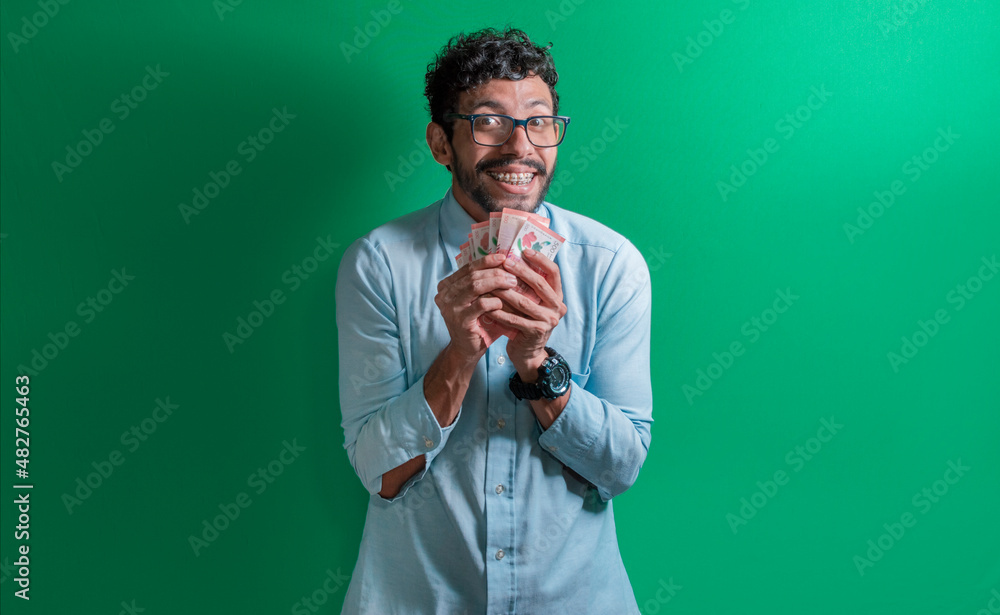 Excited man with money in his hands, Latin guy excited with money in his hands Excited man with money in his hands, Latin guy excited with money in his hands