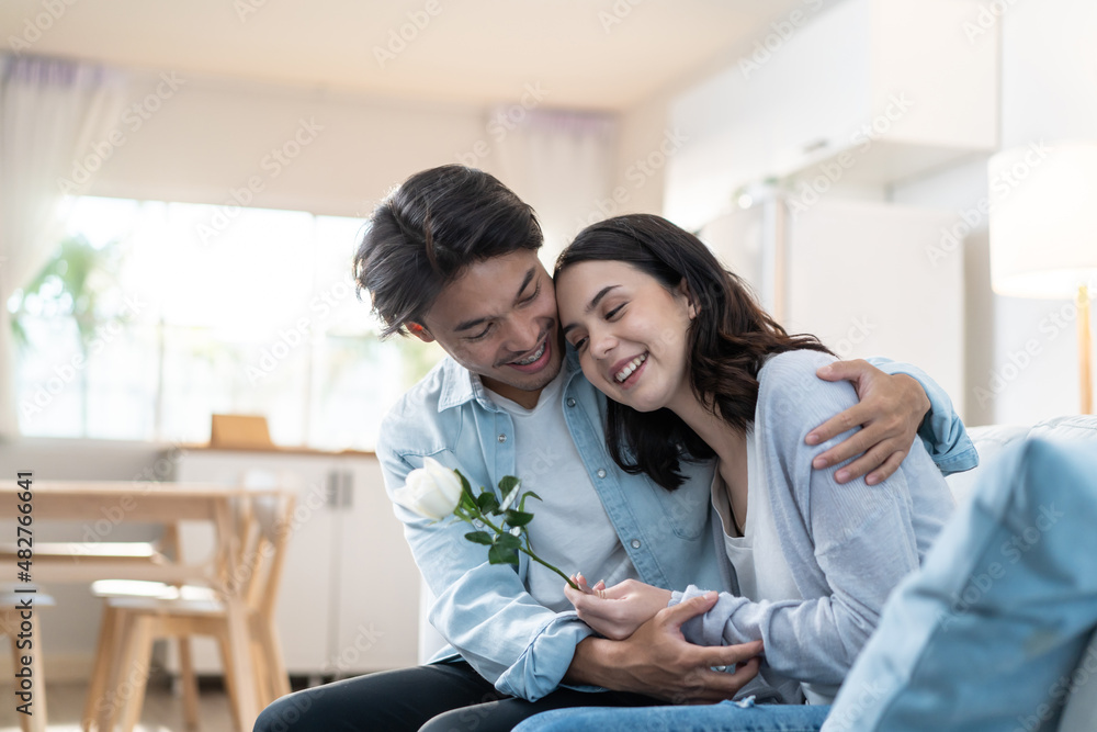 Asian young man surprise and give rose flower to beautiful girlfriend. Asian young man surprise and give rose flower to beautiful girlfriend.