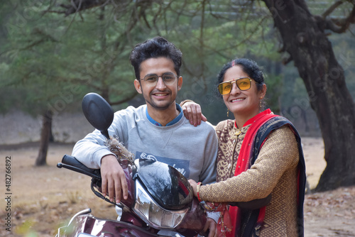 mother and his son in long trips , this is the way of india family chill out time in winter vacation ,family holiday chill out time with your two wheeler and enjoy .