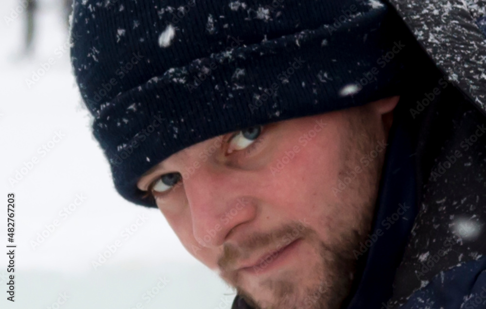 Portrait of a young man in a jacket with a hood Portrait of a young man in a jacket with a hood