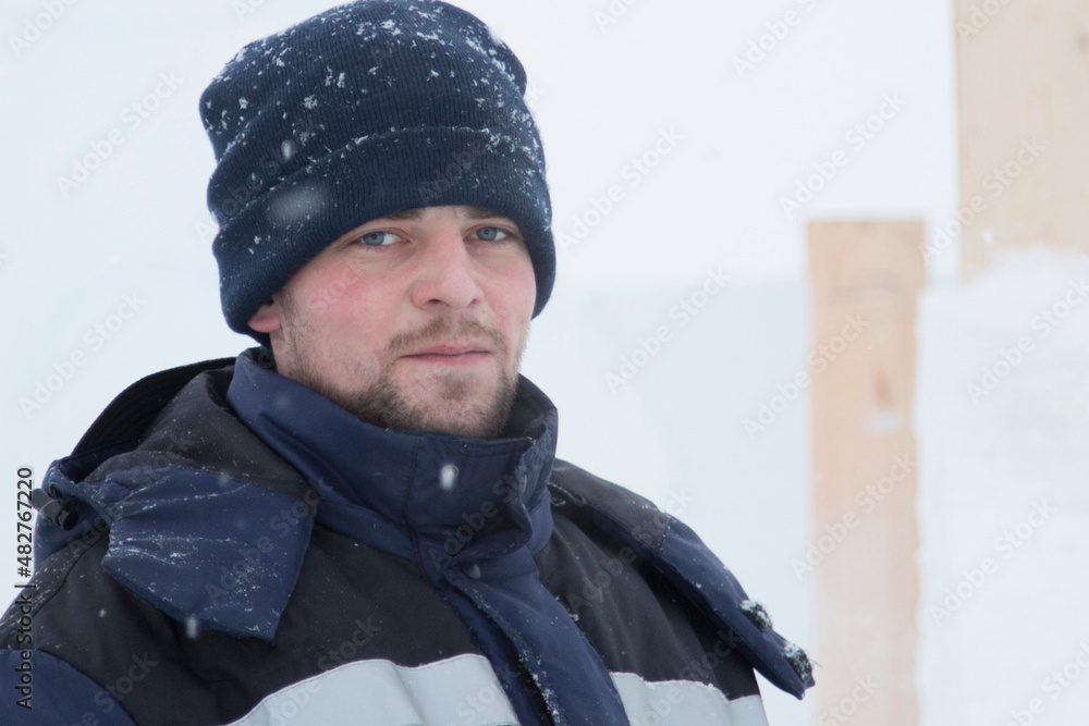 Portrait of a young man in a jacket with a hood Portrait of a young man in a jacket with a hood