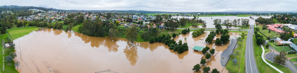 Panorama of brown floodwaters on overcast day Panorama of brown floodwaters on overcast day